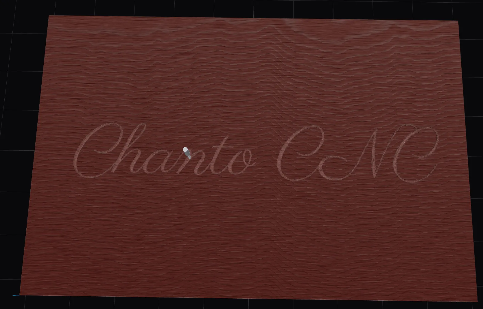 The 3D simulator mid-carve: script lettering being V-carved into a sapele board, the cutter paused over the letters
